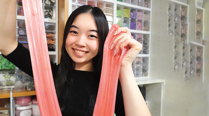 Image of a person showing off pink slime